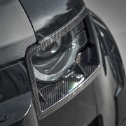Dry carbon fibre headlight covers installed on Land Rover Defender