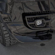 Gloss black front bumper splitter installed on Land Rover Defender 110