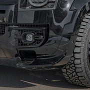 Gloss black front bumper splitter installed on Land Rover Defender 110